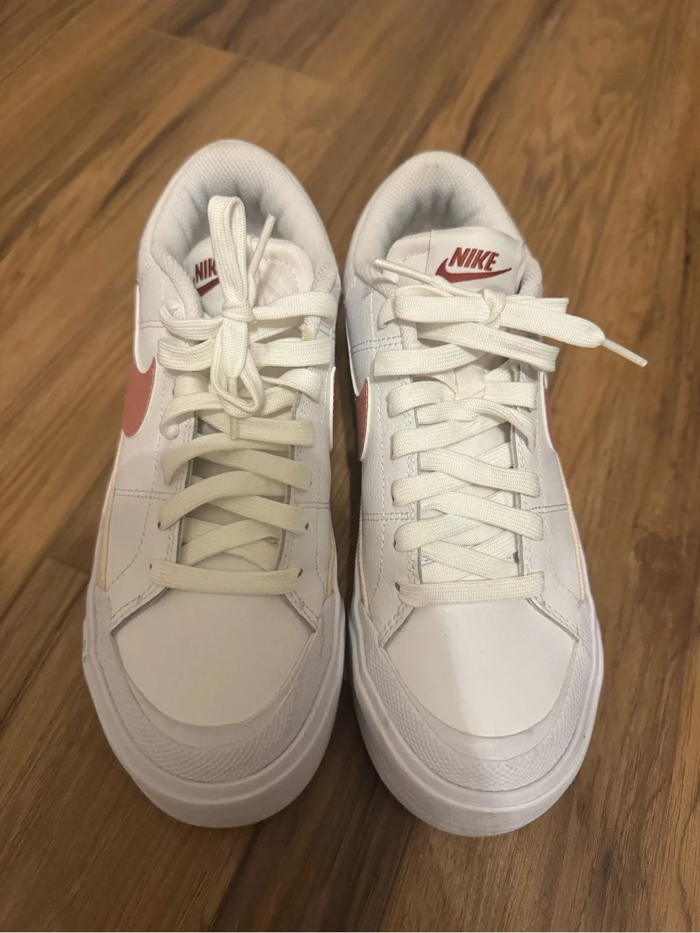 Nike Women’s White Sneakers with Rose Swoosh